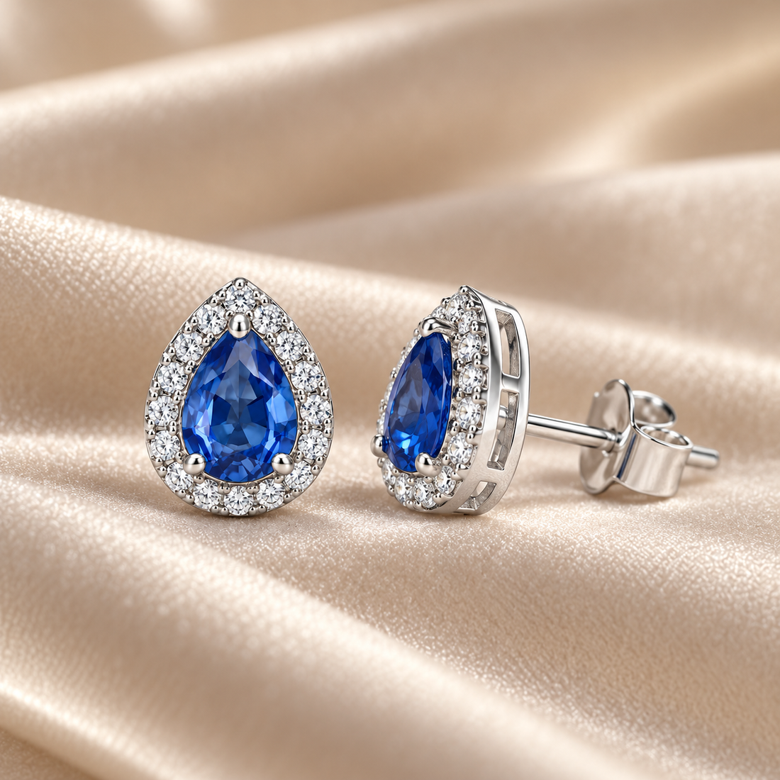 Blue Pear-Shaped Halo Stud Earrings in White Gold Tone