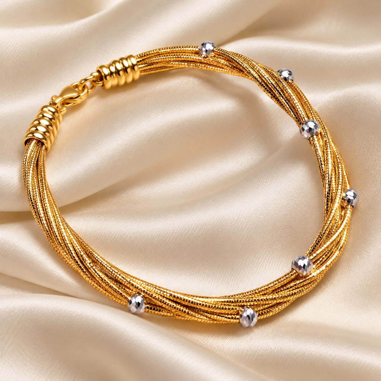Yellow Gold-Tone Twisted Multi-Strand Bracelet with Silver-Tone Faceted Beads