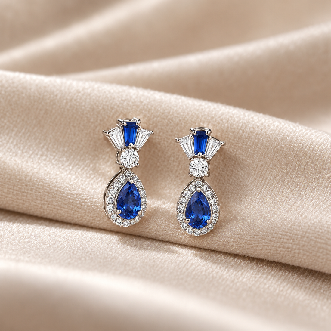 Blue Pear Halo Drop Earrings with Tapered Baguette Accents