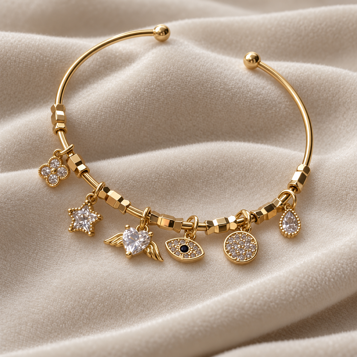 Clear Stone Winged Heart and Evil Eye Yellow Gold-Tone Charm Cuff Bracelet