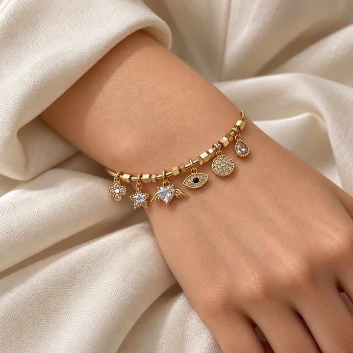 Clear Stone Winged Heart and Evil Eye Yellow Gold-Tone Charm Cuff Bracelet