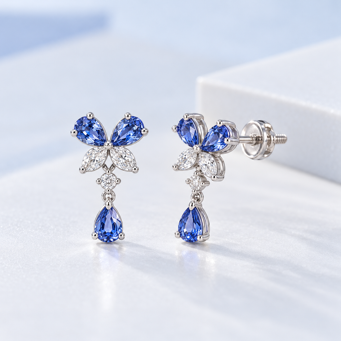 Blue Pear Drop Earrings with Butterfly Stone Cluster