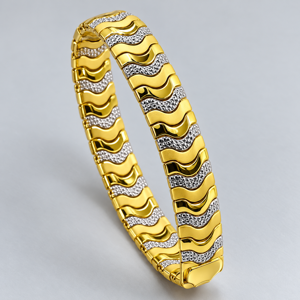 Two-Tone Gold and Silver Wave Link Bracelet with Textured Accents