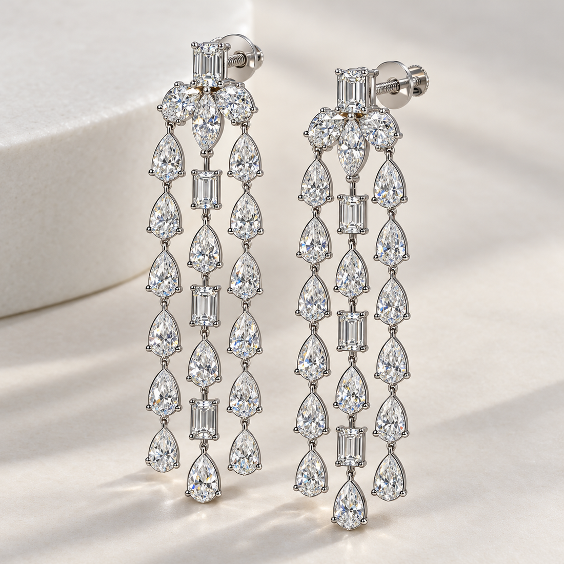 Mixed Cut Three-Strand Chandelier Earrings in White Gold Tone