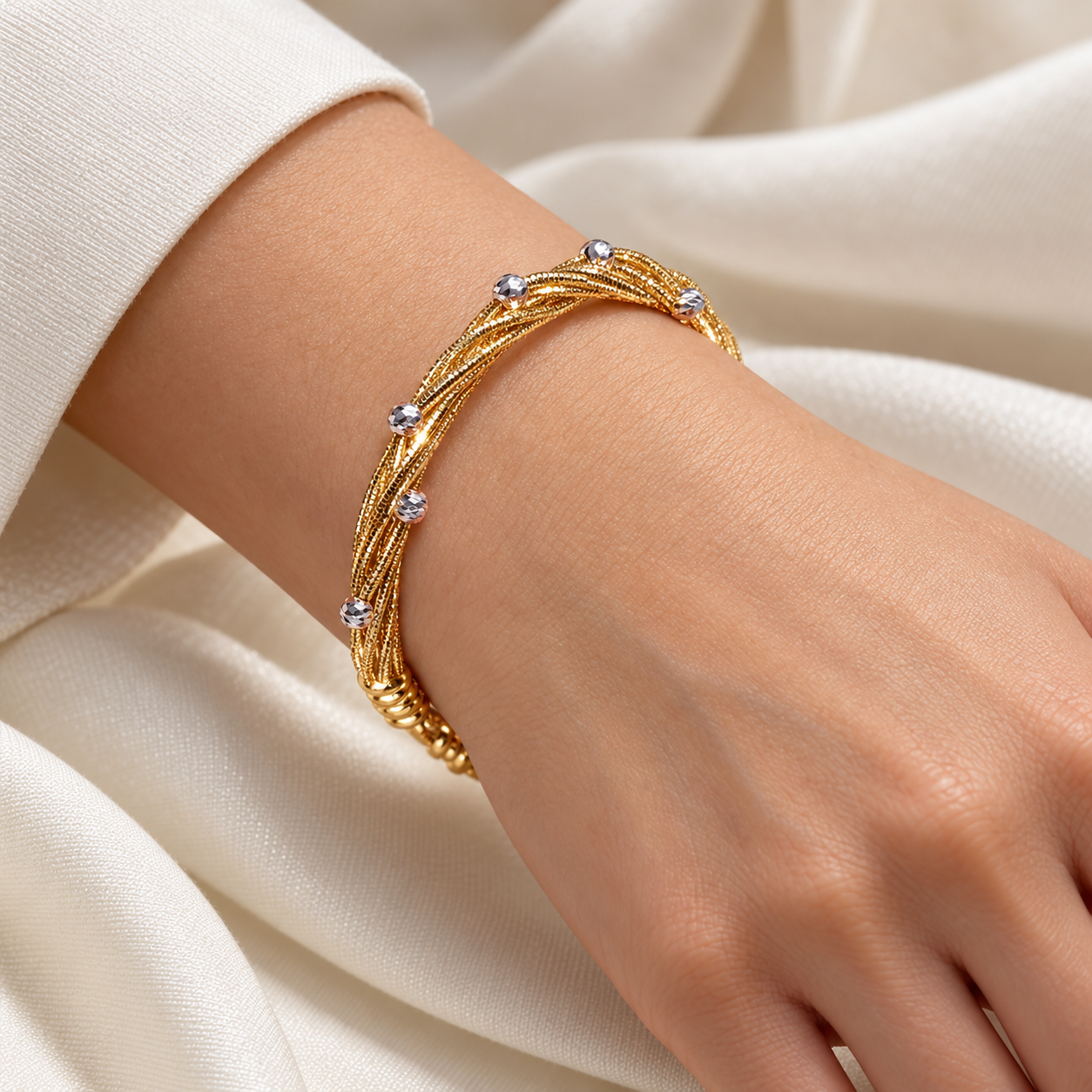Yellow Gold-Tone Twisted Multi-Strand Bracelet with Silver-Tone Faceted Beads