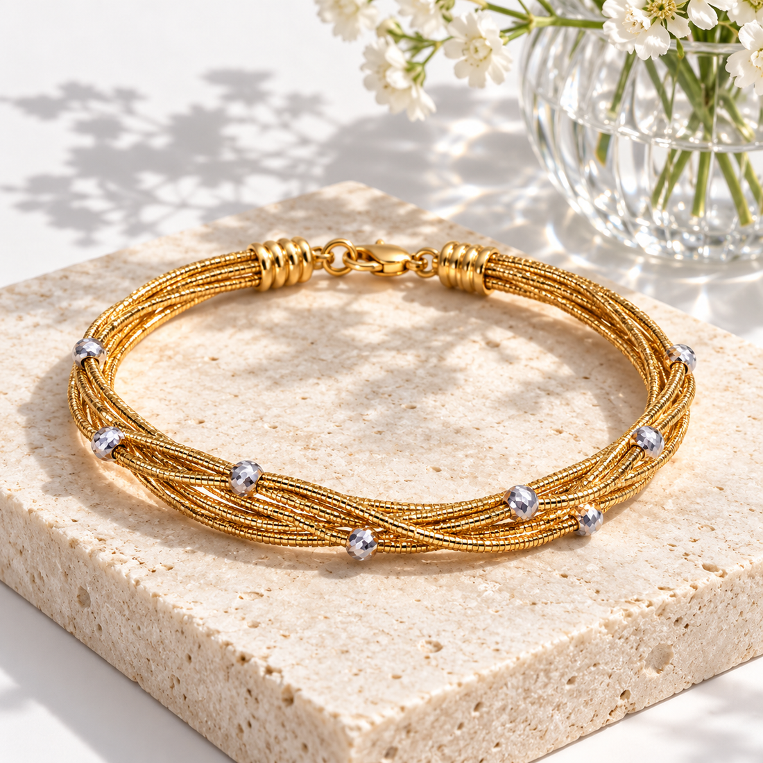 Yellow Gold-Tone Twisted Multi-Strand Bracelet with Silver-Tone Faceted Beads