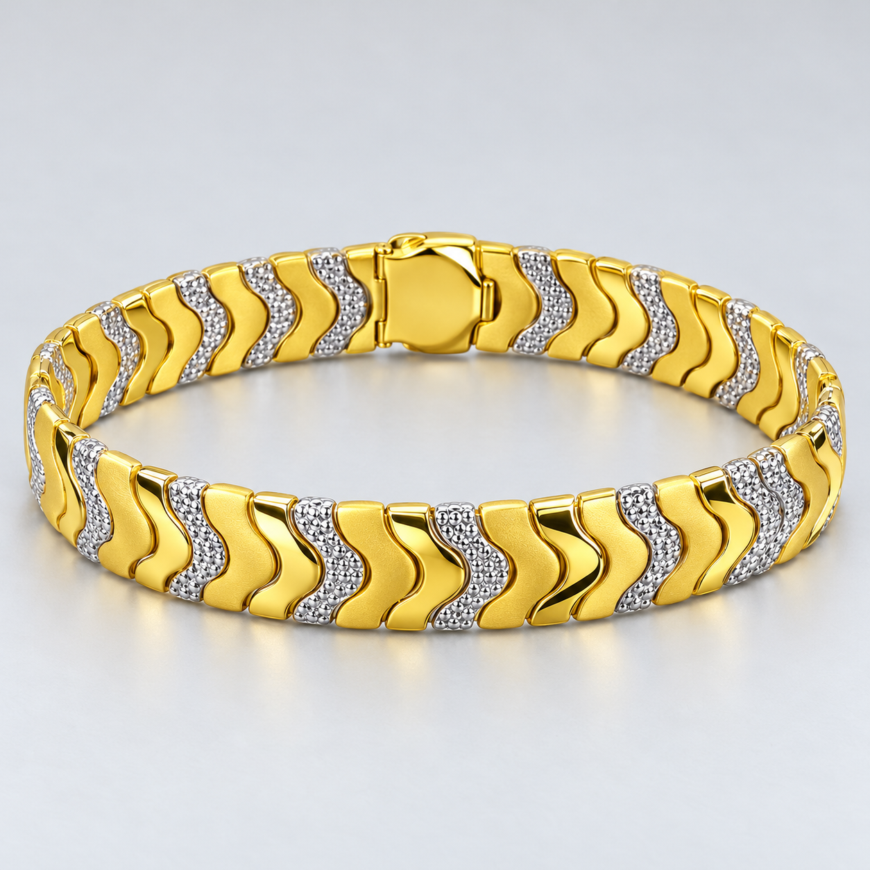 Two-Tone Gold and Silver Wave Link Bracelet with Textured Accents