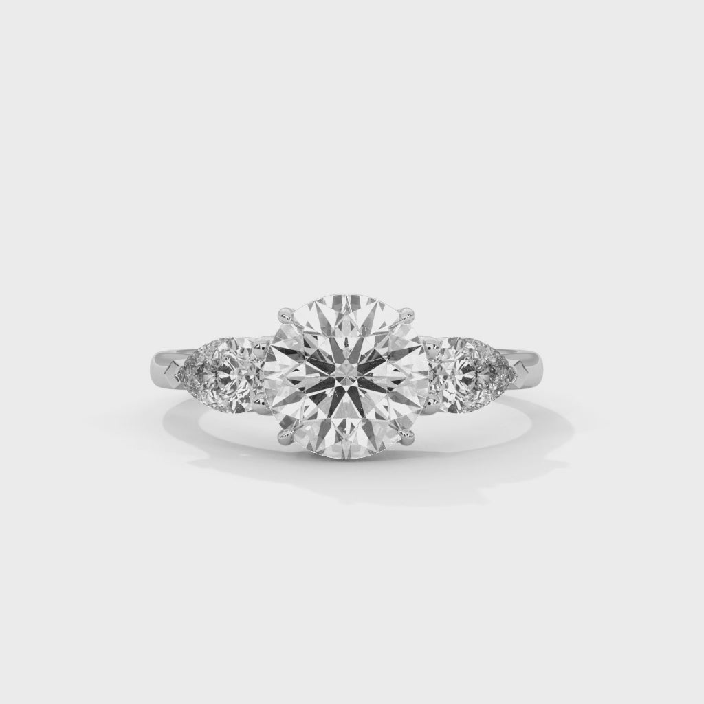 Rose Gold Round Cut Three Stone Pear Side Engagement Ring